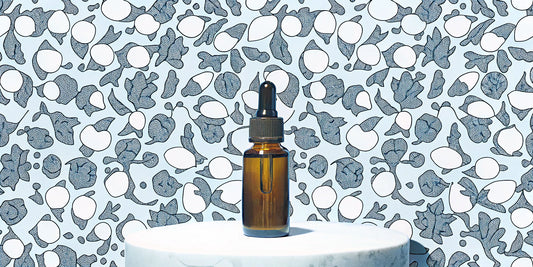 Dropper bottle of CBD oil surrounded by plants, used for its many wellness benefits.