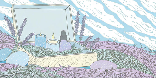 A wellness gift box with a candle, essential oil, and lavender for relaxation and self-care.