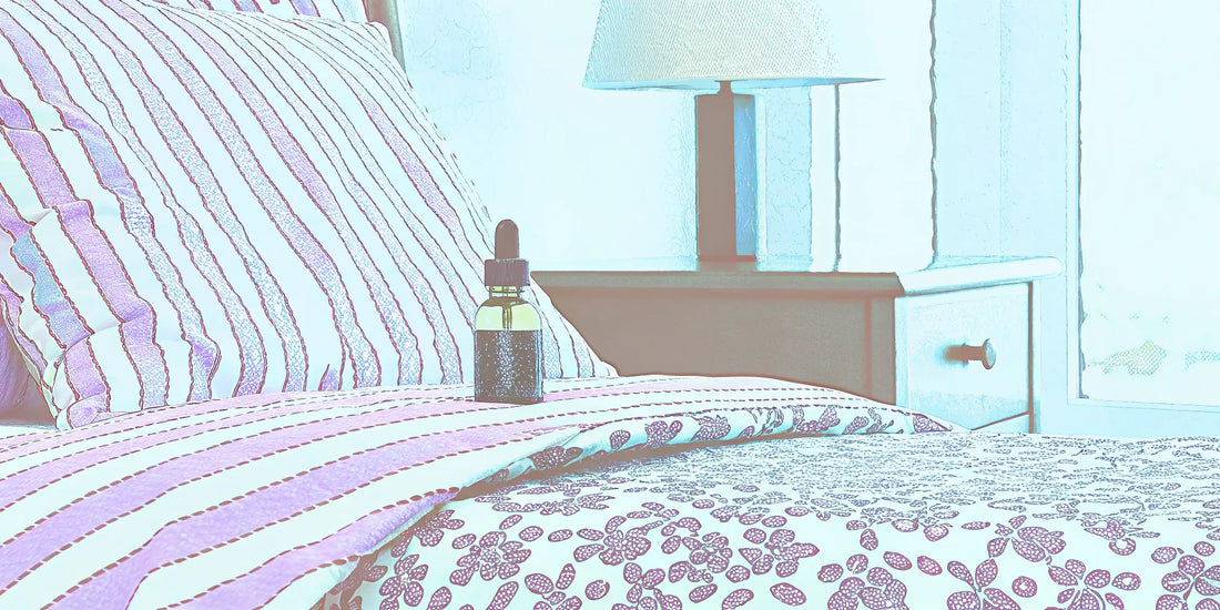 A CBN oil dropper on a bed showing the correct dosage for sleep.