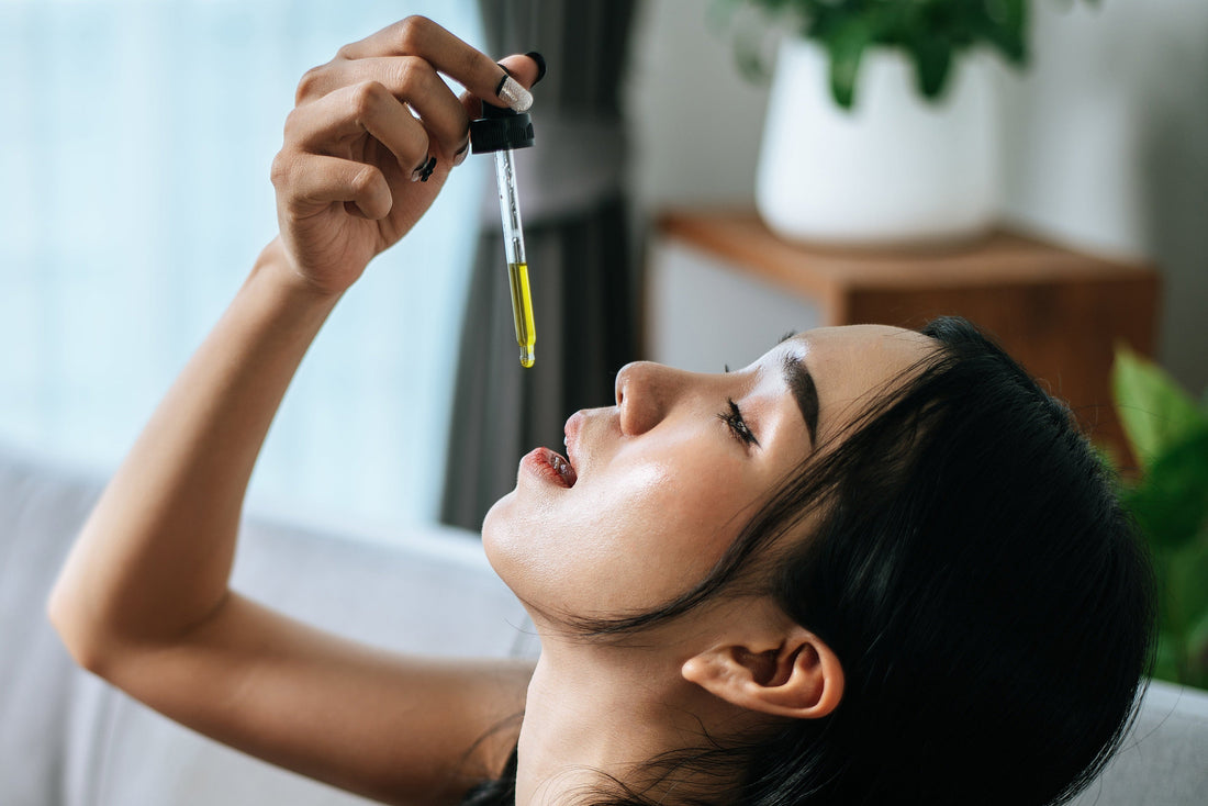 Woman nourishing her skin with olive oil