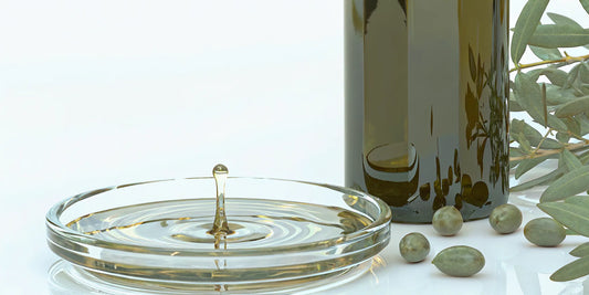 Fresh olives and a bowl of olive oil with a high polyphenol count.