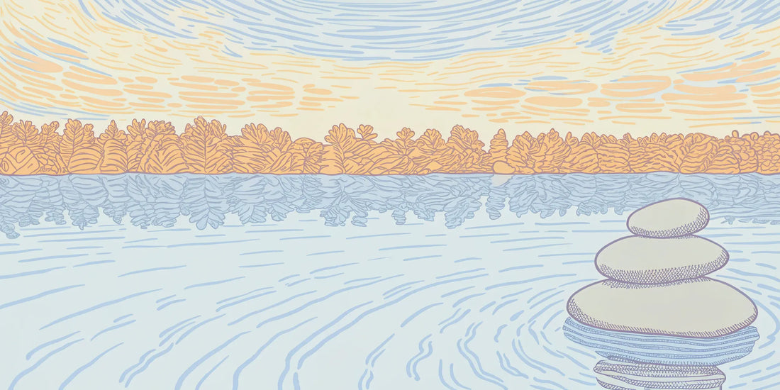 Stacked stones on a calm lake, reflecting the balance and wellness benefits of THC oil.