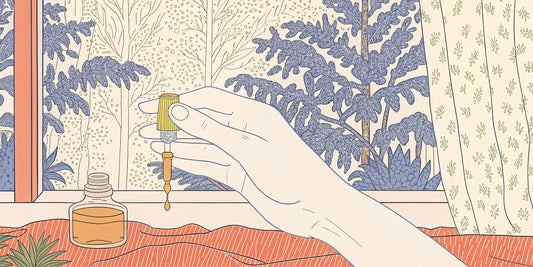 A hand carefully measures a THC oil dosage with a dropper.