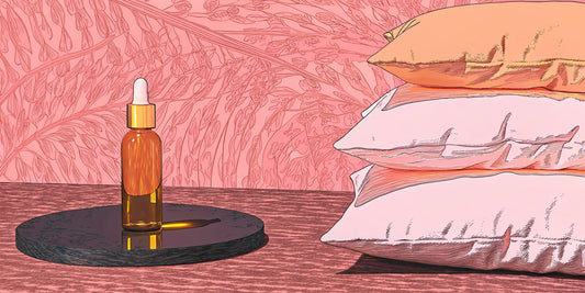 A bottle of THC oil for sleep on a nightstand next to a stack of pillows.